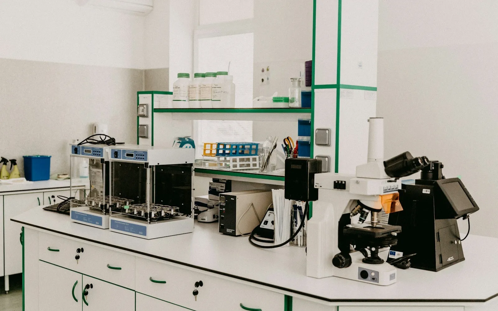 A clean laboratory bench with microscopes and analytical instruments