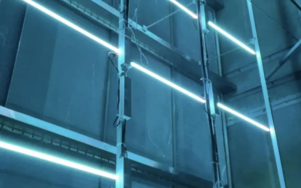 Cognituv Grid UV-C lamps lit across the coil of an air handling unit