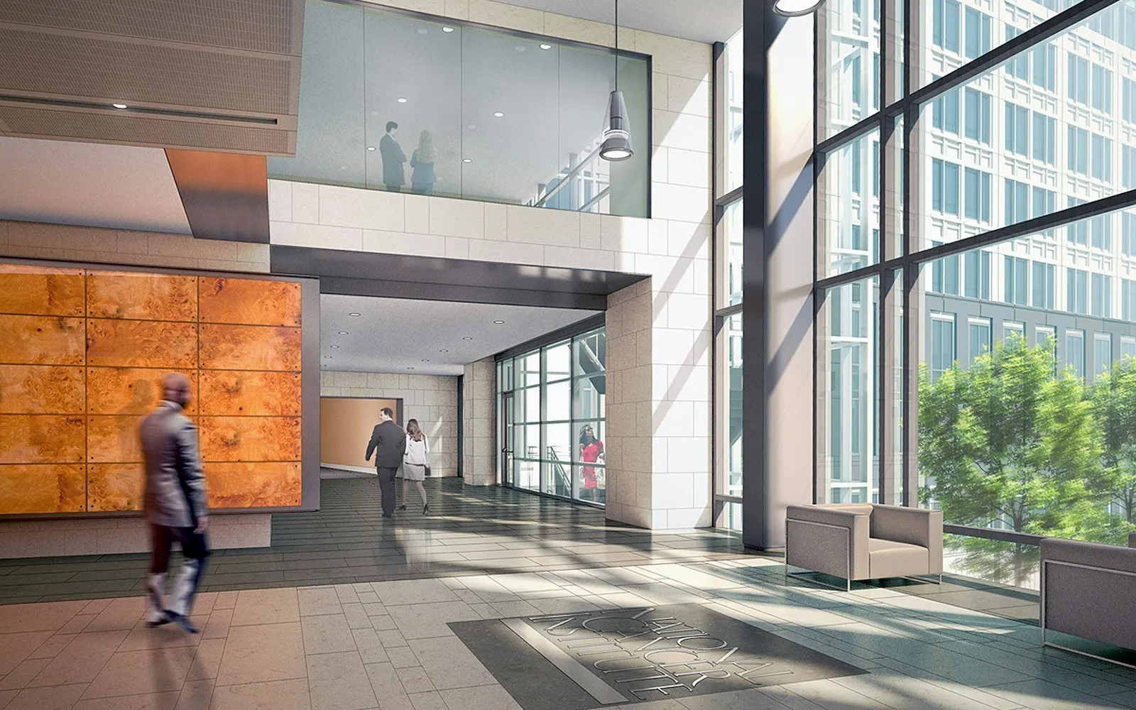 A bright office lobby with glass walls and people walking through