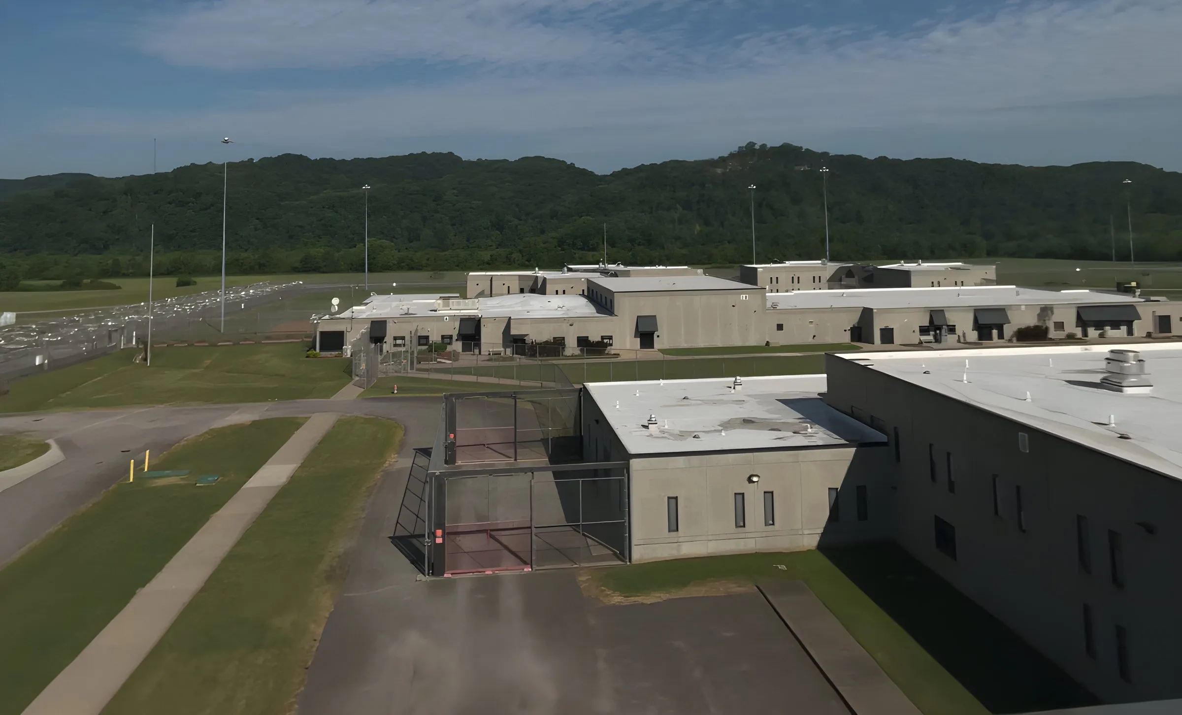 A Tennessee Department of Correction prison from above, with wooded hills behind it